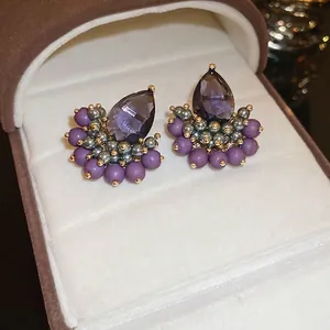 French vintage purple teardrop zircon stud earrings with pearls on white velvet box