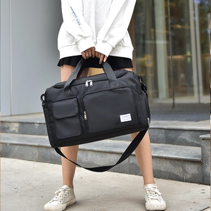 Black versatile fitness travel bag with shoe compartment and adjustable shoulder strap