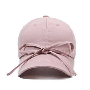Minimalist pink baseball cap for women with elegant ribbon bow decoration on the front