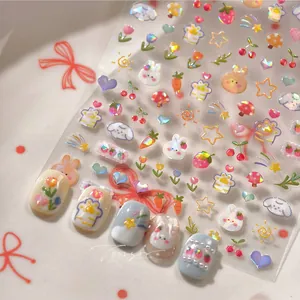 Detail of laser bunny and strawberry nail art stickers with sparkly glitter finish
