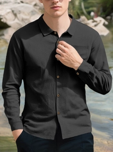 Detailed view of black waffle texture linen shirt for men featuring long sleeves and collar