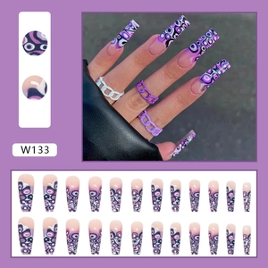 Detailed view of long coffin press on nails with purple abstract fluid marble patterns