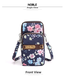Detail of floral nylon shoulder bag with three-tier zipper pockets and Smile Way logo