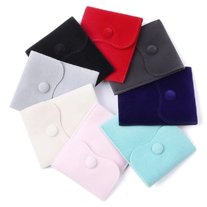 Velvet jewelry pouches with snap buttons in various colors for gift packaging