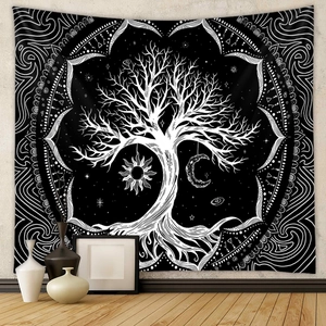 Detail of life tree tapestry with celestial sun and moon patterns in a cozy room