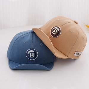 Detail of baby soft brim baseball caps in blue and khaki cotton with B patch