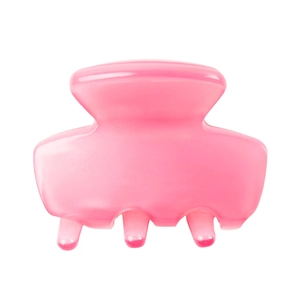 Detailed close-up of a pink acetate hair claw clip with a glossy finish and wavy edge