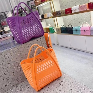 Detail of purple and orange hollow silicone basket bags with retro diamond texture