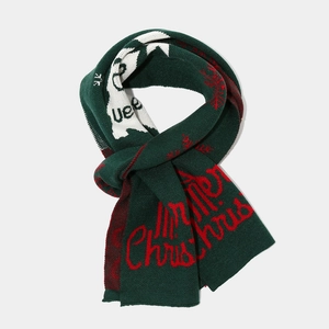 Detail of Christmas knitted scarf with Merry Christmas text and snowflake patterns