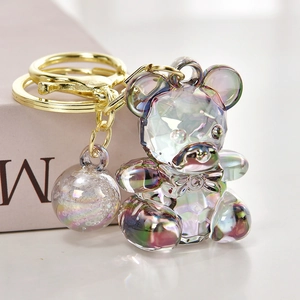 Macro shot of candy-colored acrylic bear keychain with iridescent geometric facets