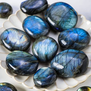 Polished natural labradorite palm stones with blue iridescent flash highlights