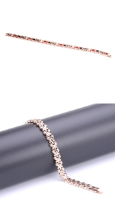Macro detail of rose gold titanium magnetic bracelet with colorful butterfly accents