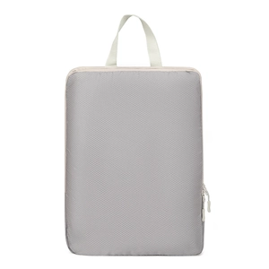 Detail of gray compression packing cube with ripstop mesh texture and carry handle