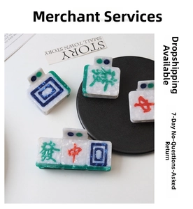 Detailed view of Mahjong pattern hair claws with Red and Green character designs