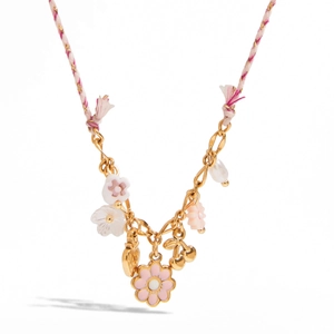 Knotted rope necklace with gold-plated pendant and pearls on white background