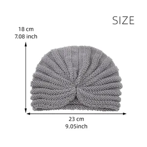 Flat lay dimensions of the knitted beanie showing 18 cm height and 23 cm width measures