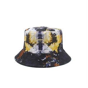 Reversible tie-dye bucket hat with abstract flame patterns and ink wash street style