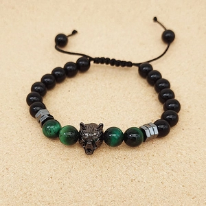 Detailed shot of adjustable bead bracelet with wolf head, tiger eye, and obsidian stones