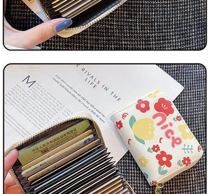 Close-up of floral multi-slot card holder with accordion design and gold zipper