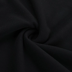 Detailed macro view of black soft fabric texture with elegant pleated drape design