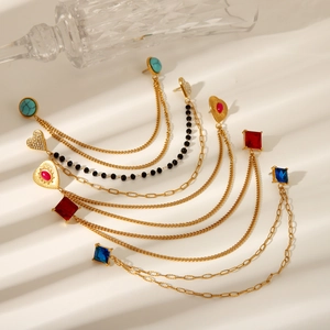 Orecchini in acciaio dorato con turchese e disegni geometrici a cuore diamantato