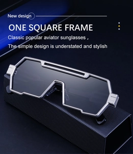 Detail of futuristic silver metallic wrap sunglasses on carbon fiber background