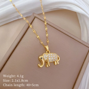 Macro shot of gold elephant necklace pendant featuring sparkling crystals on leather