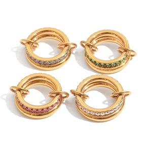 Luxurious interconnected gold rings featuring purple, green, red, and white cubic zirconia
