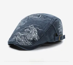 Side view of vintage denim flat cap with white dragon embroidery and metal buckle