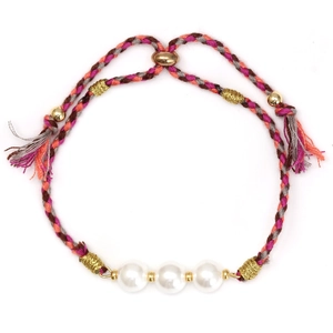 Close-up of woven pearl bracelet with colorful cords and adjustable golden slide clasp