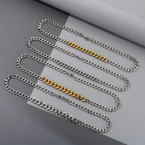 Detail of silver and two-tone gold Cuban link bracelets with secure lobster clasps