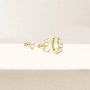 Detailed close-up of S925 hallmark on gold plated sterling silver pearl and zircon earrings
