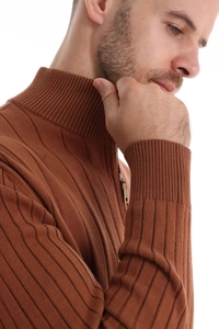 Detail of men's brown half-zip sweater showing vertical knit texture and collar craftsmanship