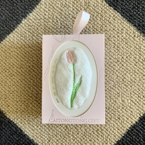 Pink gift box with white coral fleece towel featuring tulip embroidery and ribbon handle