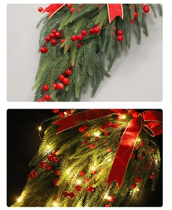 Detail of Christmas teardrop swag with red berries, velvet bow and glowing LED lights