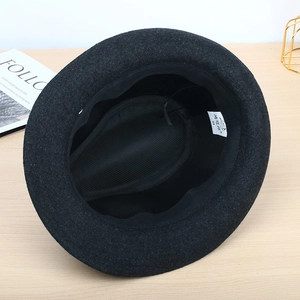 Close-up of black wool fedora interior showing lining, sweatband and adjustable drawstring