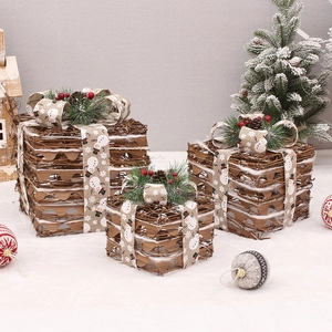 Three-piece set of LED lighted Christmas gift boxes with rustic pine needles and cones