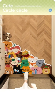 Detail of colorful cartoon animal PVC floor mat on herringbone wood floor with slippers