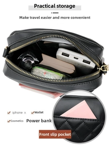 Detail view of black quilted PU crossbody bag showing internal capacity for phone and makeup