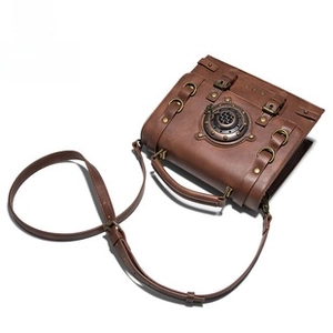 Close-up of steampunk messenger bag with metal gears and vintage brown leather texture