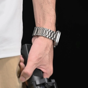 Close-up of premium titanium link watch band for iWatch Ultra in silver-grey finish