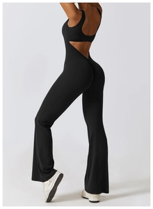 Detail of backless black flare yoga bodysuit with high-waist scrunch butt design