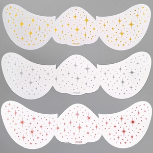 Detailed view of K92005 freckle face tattoos in gold, silver, and pink star patterns