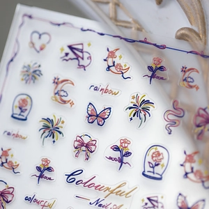 Colorful embroidery style nail stickers featuring butterflies, rainbows and floral art