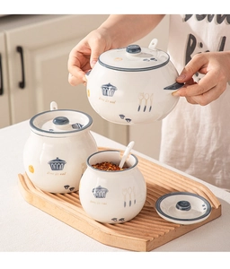 Ceramic seasoning jar set with wooden tray featuring blue patterns and matching spoons