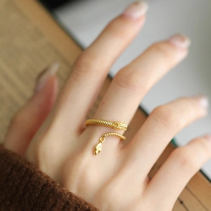 Adjustable golden dragon-shaped ring in S925 silver with a delicate hanging tail charm