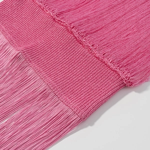 Close-up detail of high-quality bright pink fringe tassels and woven trim for dresses