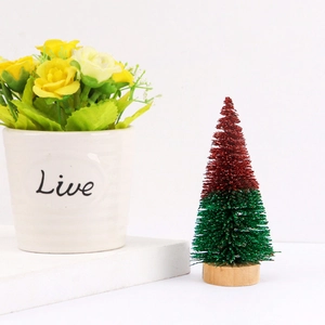 Mini cedar Christmas tree with gold bells and wood base for festive desktop decor