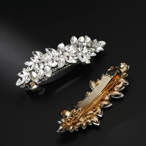 Detail of marquise-cut crystal hair clip showing intricate floral setting and spring mechanism