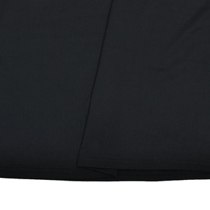 Close-up detail showing the fine stitching and hem texture of the black bodycon dress